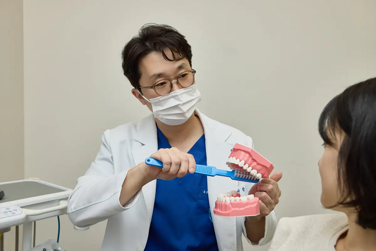 Dentist explaining an X-ray to a patient